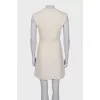 White dress with golden pin