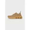 Golden sneakers with a figured sole