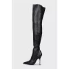 Over the knee boots with a figured heel