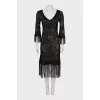 Semi-transparent dress decorated with fringe