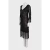 Semi-transparent dress decorated with fringe