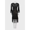 Semi-transparent dress decorated with fringe