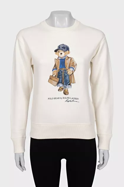 White sweatshirt with branded print and tag