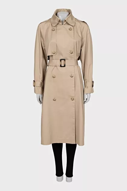 Beige trench coat with buckles