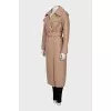 Beige raincoat with buttons