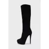 Black suede boots with a zipper