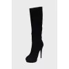 Black suede boots with a zipper
