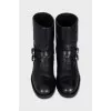 Leather boots decorated with straps