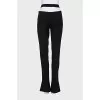 Black flared trousers with slits