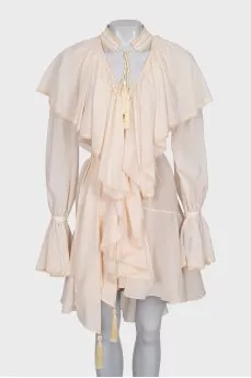 Dress with ruffles and tassels
