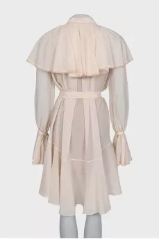 Dress with ruffles and tassels