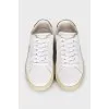 Leather sneakers with signature embroidery