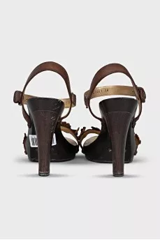 Brown sandals decorated with flowers