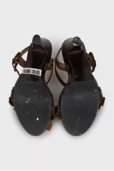 Brown sandals decorated with flowers