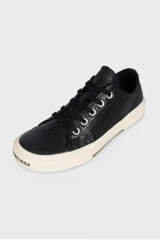 Leather sneakers with a logo on the front