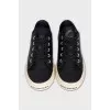 Leather sneakers with a logo on the front