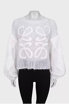 Knitted sweater with a raised logo