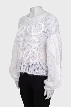 Knitted sweater with a raised logo