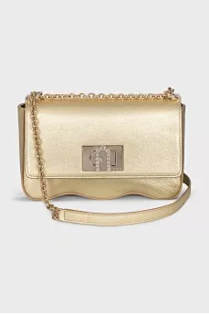 A gold leather bag decorated with crystals