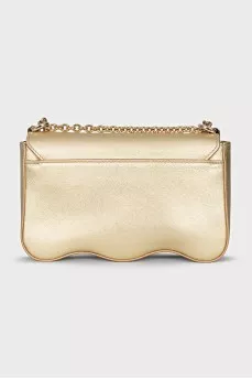 A gold leather bag decorated with crystals