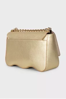 A gold leather bag decorated with crystals