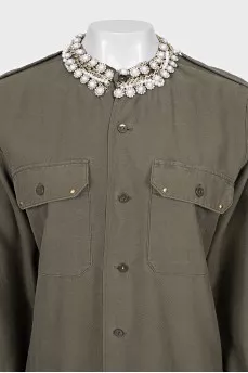 Asymmetrical shirt decorated with crystals
