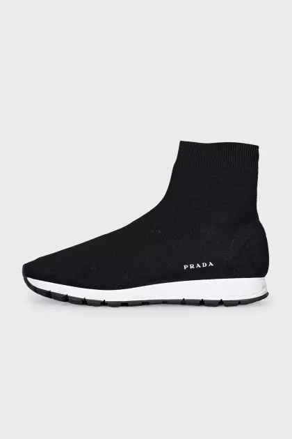 Black textile sneakers with a white sole