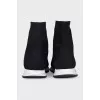Black textile sneakers with a white sole