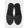 Black textile sneakers with a white sole