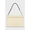 Yellow leather bag with tag