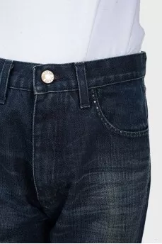 Jeans with scuffs and rhinestones