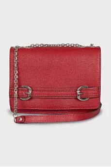 The red bag is decorated with a strap