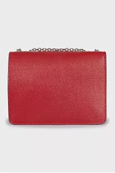 The red bag is decorated with a strap