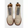 Beige boots with perforations
