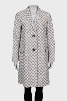 Straight-cut coat with a polka dot print