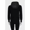 Black zip-up jacket with a hood