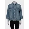Denim jacket decorated with zippers