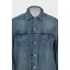 Denim jacket decorated with zippers