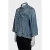 Denim jacket decorated with zippers