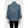 Denim jacket decorated with zippers