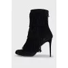 Black ankle boots with fringe