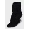 Black ankle boots with fringe