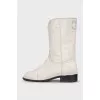 Logo-embossed shaggy leather boots