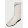 Logo-embossed shaggy leather boots