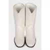 Logo-embossed shaggy leather boots