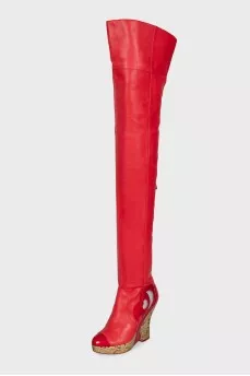 Leather over-the-knee boots with a gold wedge heel