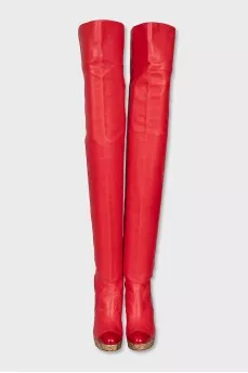 Leather over-the-knee boots with a gold wedge heel