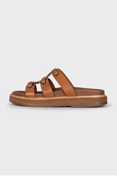 Brown sandals with gold hardware
