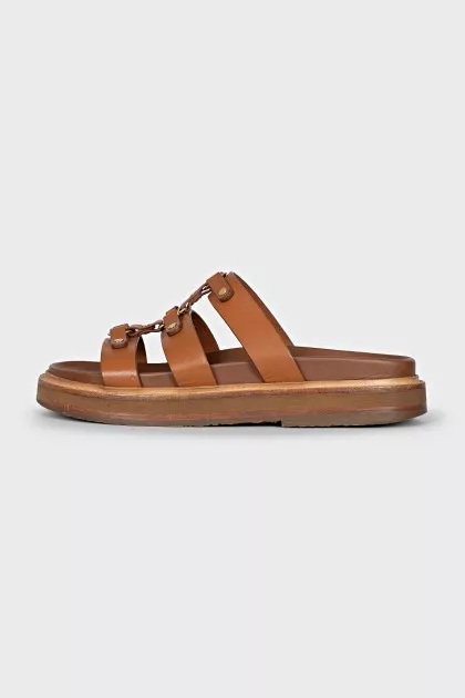 Brown sandals with gold hardware