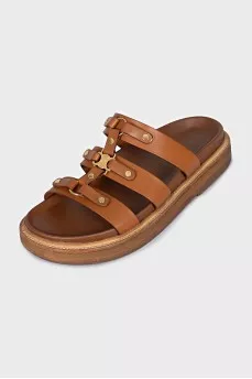 Brown sandals with gold hardware